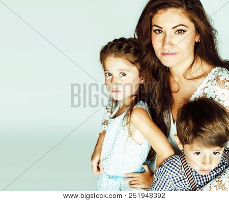 Young Mother With Two Children On White Background, Happy Smilin