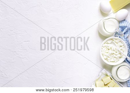 Assortment Of Dairy Products ( Cheese, Cream, Milk, Eggs, Curd, Butter ) .top View With Copy Space.