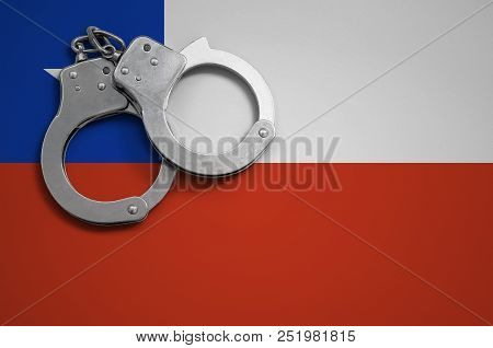 Chile Flag  And Police Handcuffs. The Concept Of Crime And Offenses In The Country