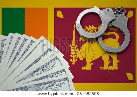 Sri Lanka Flag  With Handcuffs And A Bundle Of Dollars. The Concept Of Illegal Banking Operations In