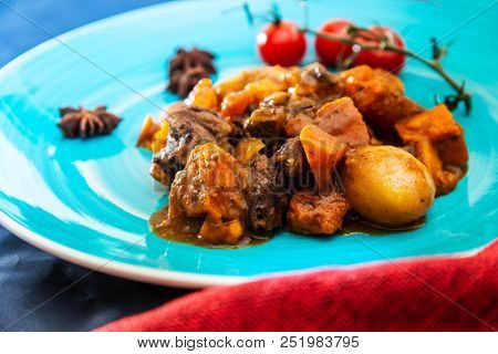 Beef meat stewed with potatoes-Traditional French cuisine Beef Bourguignon potatoes carrots in persillade