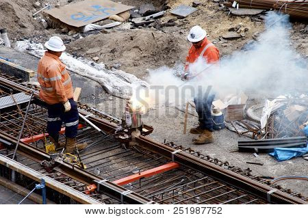 Newcastle, Nsw, Australia - July 28, 2018:construction Workers Joining Steel Track On The Light Rail