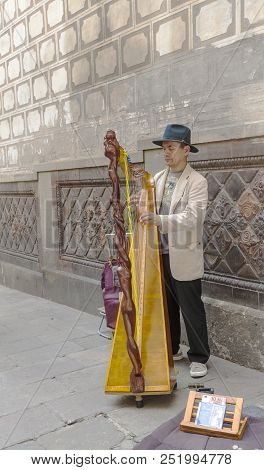 Barcelona, Spain 9 June 2018:  Unknown Street Harpist On One Of The Streets In Old Downtown.
