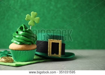 Decorated Cupcake, Hat And Coins On Grey Table, Space For Text. St. Patrick's Day Celebration