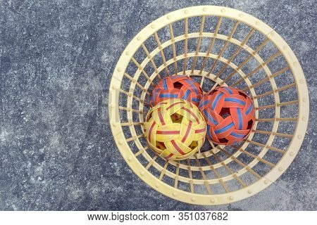 The Takraws In The Plastic Basket On The Cement Floor Beside The Field Is Used For Students To Pract