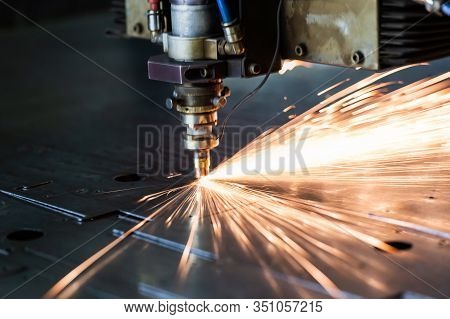 Laser Cutting Process With A Sheaf Of Sparks And Motion Blur Of Head Unit While Piercing Through Zin