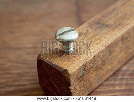 Wood Crafted Handmade Bottlecap Opener For Beer Bottles Built With A Piece Of Wood And A Metal Screw