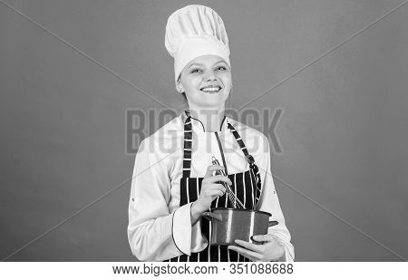 Woman Professional Chef Hold Whisk And Pot. Whipping Like Pro. Girl In Apron Whipping Eggs Or Cream.