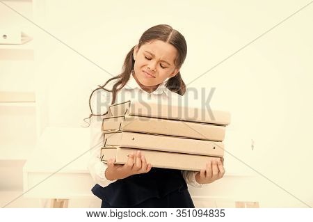 So Heavy. Small Girl In School Uniform. Lot Of Homework. Get Information. Kid Learn And Study Hard. 