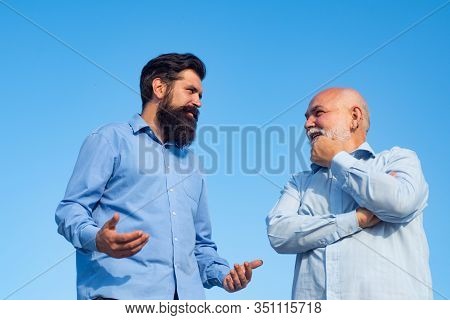 Handsome Senior Men In Blue Shirt. Male Multi Generation Family Walking. Happy Grandfather And Fathe