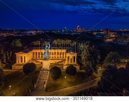 The Popular Statue Bavaria Shown From Above In The City Lights Of Munich.