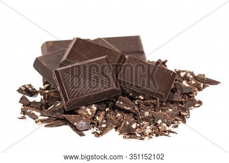Broken craked chocolate parts isolated on white background
