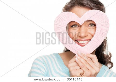 Smiling middle aged woman wird heart