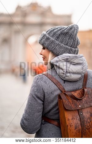 Blonde Girl Back In Coat And Hat On The Street In The Rain In Istanbul In The Park