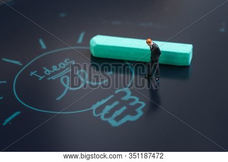 Idea, Brainstrom Or Business Solution Concept, Miniature People Businessman In Suit Standing And Thi