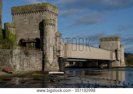 The Metal Box Railway Bridge At The Side Of Conwy Castle Crosses The River Conwy. The Castle Was Bui