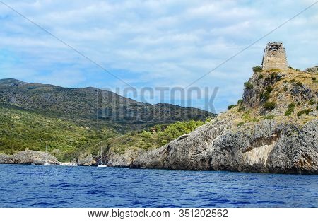 Cala Bianca Beach And The Saracen Tower Near Camerota From The Sea, Campania, Italy