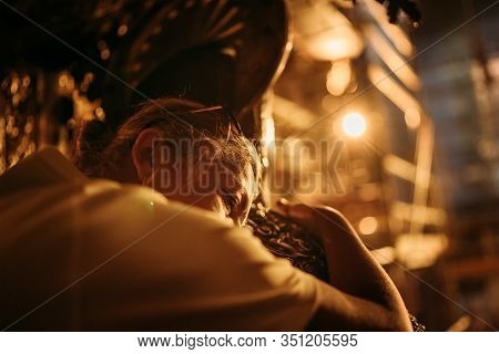 Female Hugging A Statue Of Saint James. It Is Traditional To Hug Or Pat His Statue In Order To Thank