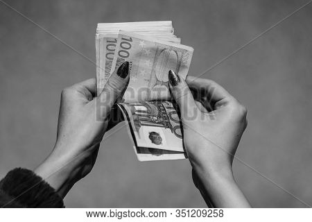 Hand Couting Holding And Showing Euro Money Or Giving Money. World Money Concept, 100 Euro Banknotes