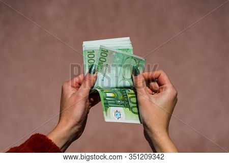 Hand Couting Holding And Showing Euro Money Or Giving Money. World Money Concept, 100 Euro Banknotes