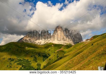 Photograph Of The Peaks Of A Cloud-covered Mountains