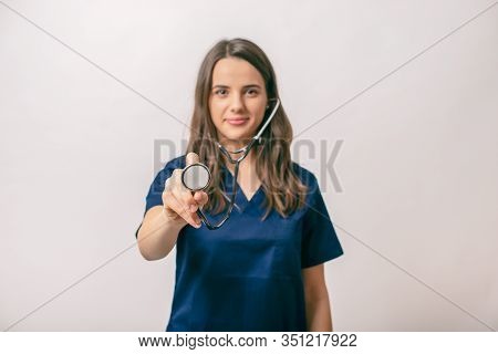 Beutifull Young Medic Woman  Holding A Stethoscope, Isolated Over White