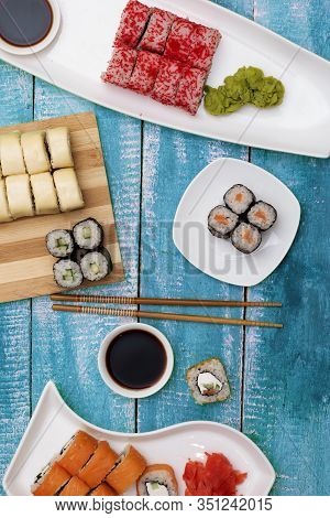 Delicious Set Of Variation Sushi Rolls With Traditional Soy Sauce And Chopsticks On Asian Plates, Fl