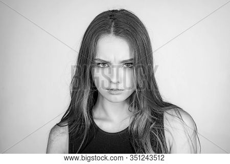 Fashion Portrait Of A Beautiful Young Woman Posing Over White Background. Close Up Portrait Of A Bea