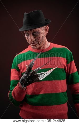 Portrait Of A Man With A Scary Face And Metal Claws. Grimm Hero For A Horror Movie