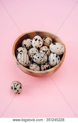 Quail Eggs In Basket On A Pink Background. Easter Concept, Flay Lay Photo. Mockup, Space For Text.
