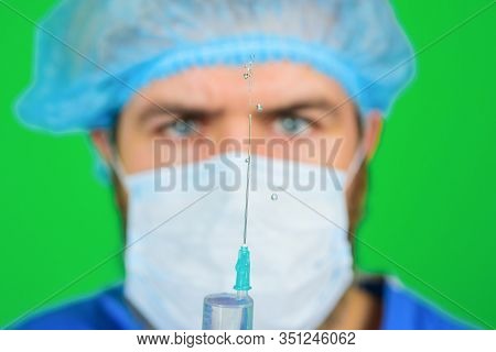 Vaccination For People. Injection. Doctor With Syringe. Coronavirus. Doctor Makes Vaccination. Selec