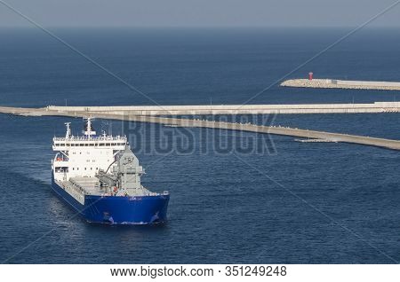 Maritime Transport - The Ship Sails Through The Port Channel To The Transhipment Terminal