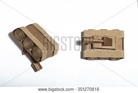 Two Toy Tanks Made By Children From Corrugated Cardboard. Toy Cardboard Tanks Isolated On A White Ba