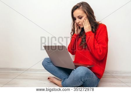 Girl With Laptop And Phone At Home.
