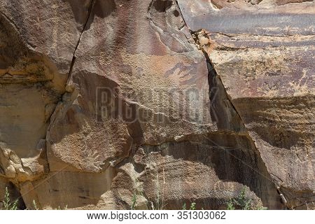 Strange Shapes And Figures That Have Been Carved Into The Ancient Sandstone Rocks At Legend Rock Sta