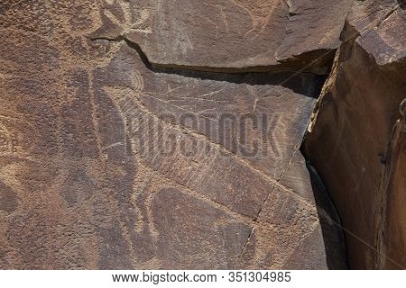 Strange Shapes And Figures That Have Been Carved Into The Ancient Sandstone Rocks At Legend Rock Sta