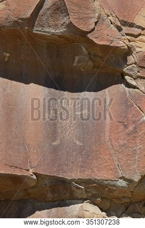 Strange Shapes And Figures That Have Been Carved Into The Ancient Sandstone Rocks At Legend Rock Sta