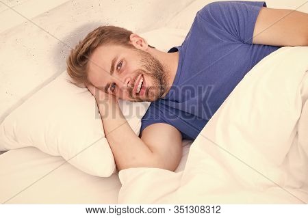Experiencing A Supreme Pleasure. Single Man Smiling After Waking Up In Morning. Single Person Lying 