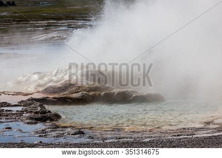 The Formation Of Clepsydra Geyser As Its Shoots Hot Water And Steam Into The Air At Yellowstone Nati