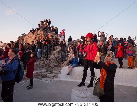 People Watch The Sunset In Oia, Santorini, Greece
