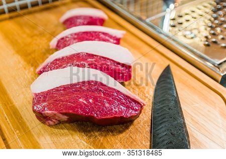 Beautiful Photo Of Picanha (top Sirloin Cap) Cuts On A Wooden Cu