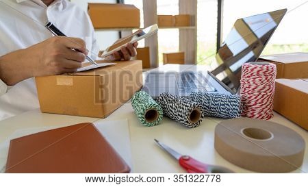 Startup Small Business Entrepreneur Sme, Young Asian Man Working With Laptop Computer And Delivery P