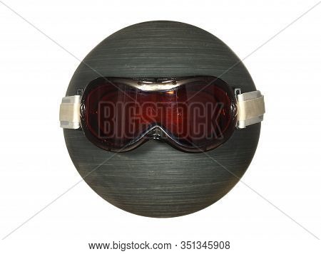 Ski Goggles On A Black Plastic Ball Isolated On A White Background.