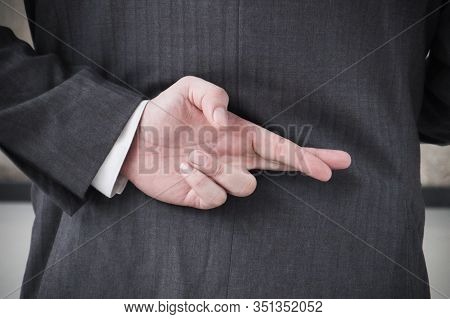 Businessman With His Fingers Crossed Behind His Back.dishonest Relationship And Betrayal Concept