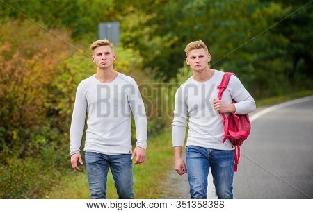 Cheap Travel. Friendship Concept. Men Hitch Hiking. Man Casual Style Travel With Backpack. Traveler 