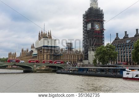 London, United Kingdom- June 2019: Big Ben, Houses Of Parliament And Westminster Bridge With Four Re