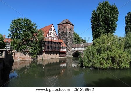 Nuremberg City, Germany - Wasserturm Medieval Tower And Henkersteg Bridge.