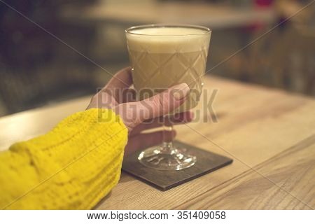 Latte Raff Coffee With Foam In Transparent Glass On Wooden Table, Morning Invigorating Drink. Coffee