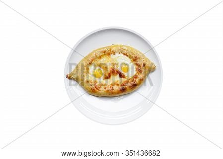 Adjarian Khachapuri With Quail Eggs And Cheese, Isolated. On A White Ceramic Plate. Top View. Georgi