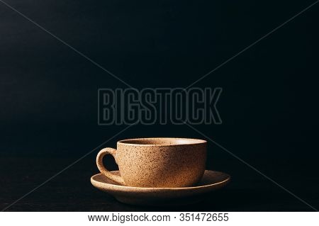 Cup With Black Coffee On A Black Background.